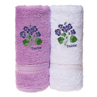 White towel with violet embroideries
